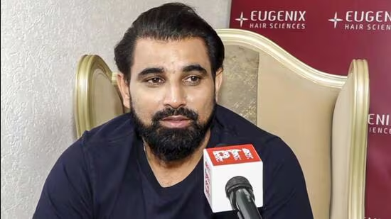 Mohammed Shami charging in with a full run-up at the M Chinnaswamy Stadium on Sunday.